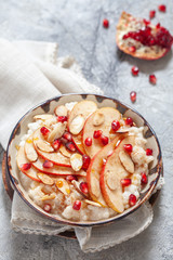 Coconut rice with pomegranate, pear and almond slices