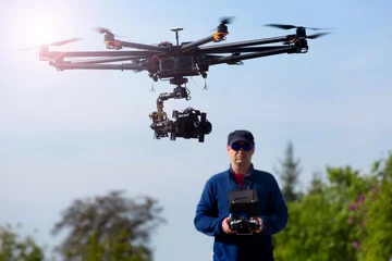 Fotobehang Drone,  pilot flying drone  © wip-studio