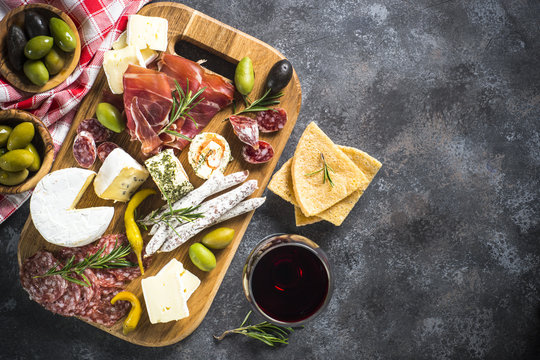 Antipasto Board With Sliced Meat, Ham, Salami, Cheese, Olives An