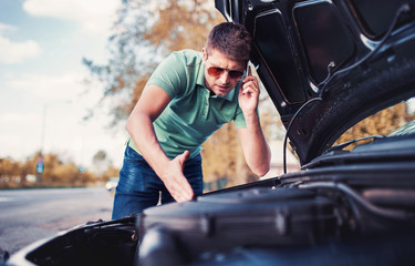 Problem with a car. A broken car on the road