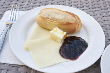 Breakfast with bread, butter, cheese and preserve
