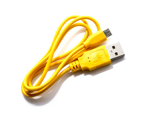 yellow charger wire on white background.