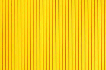 Wooden walls painted yellow stripes