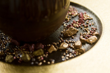Obraz na płótnie Canvas A Chocolate desert with green leaves prepared by a chef