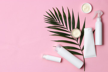 natural cosmetics and green leaf on a colored background top view. flatlay 