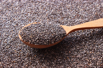 chia seeds on a wooden background. Useful supplements, super food, healthy food, veggie