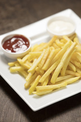 french fries wit ketchup over white plate