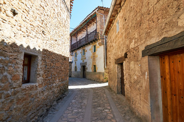 Narrow street in the historic town of Orbaneja del Castillo