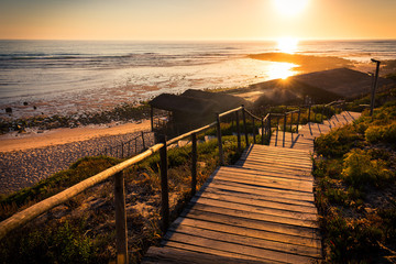 Wooden beach hut on Portugal's Alentejo coast at sunset
