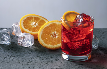 Cocktail with ice and orange.