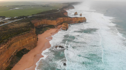 Overhead aerial panoramic view of Twelve Apostles on a cloudy sunrise, Australia
