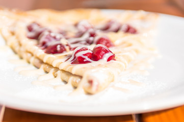 Pancake with cherries with almond cream