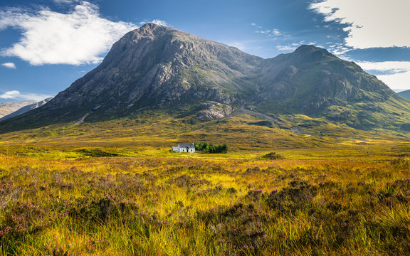 The remote Lagangarbh Hut in front of Buachaille Etive Mor in Glen Coe on a beautiful summer afternoon, Scotland