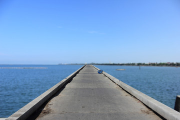 Fototapeta na wymiar concrete bridge for walkway into the sea