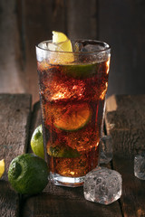 Cocktail with ice coke and lime - obrazy, fototapety, plakaty
