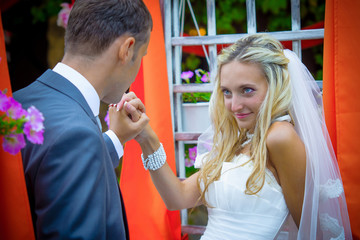 Wedding. Happy bride and groom in park
