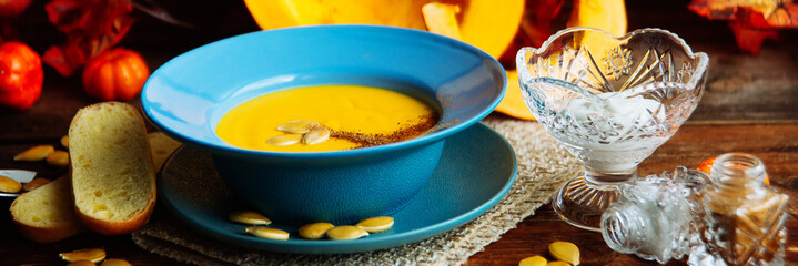 Pumpkin soup served in a hollowed pumpkins
