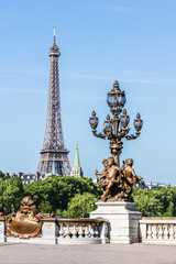 Fototapeta na wymiar Pont Alexandre III Bridge (details) and Eiffel Tower. Paris, France