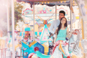 Obraz na płótnie Canvas Young couple on a date at the fair
