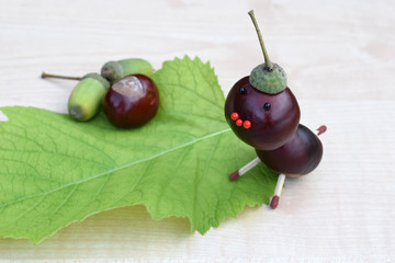 Figurine made of chestnuts and acorns