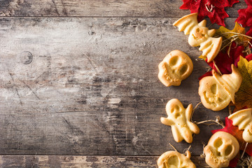 Homemade Halloween cookies on wooden table. Top view. Copyspace