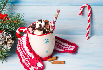 Colorful marshmallows in a cup with festive decorations