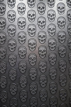 Pattern of skulls on gray surface