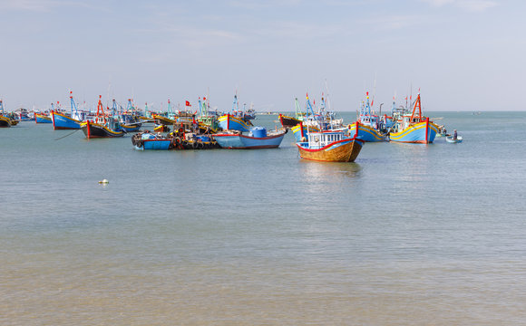 Fishing harbor full of boats in a bay in Mui Ne, Vietnam