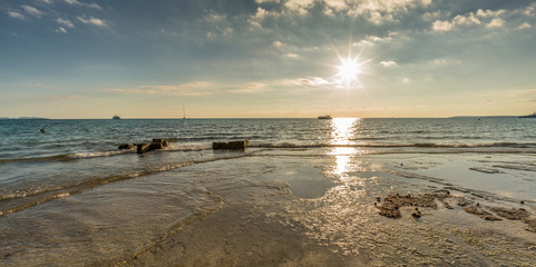 Beautiful sun reflections, late afternoon scene in Es Trenc beach. Majorca Island, Spain