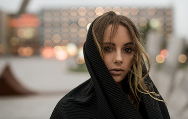Close up fashion portrait of Positive fashion shine beautyful girl enjoy life. Portrait of beautiful caucasian woman with beautiful face walking outdoors during a wind. Copy space.