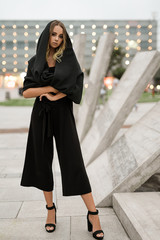 At full haight fashion portrait of Positive fashion shine beautyful girl enjoy life. Portrait of beautiful caucasian woman with beautiful face walking outdoors. Copy space.