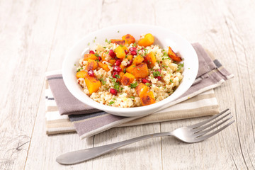 vegetarian meal with quinoa, pumpkin and pomegranate