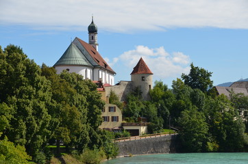 view of the Lech river with church, trees and abbey