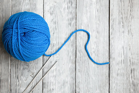 blue ball of wool yarn for close-up knitting on a white background