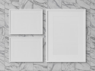 White rectangular frames hanging on a marble wall mockup 3D rendering