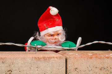 Santa trying to climb the wall