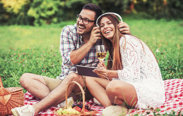 Couple enjoying picnic together. Love and tenderness, dating, romance, lifestyle concept