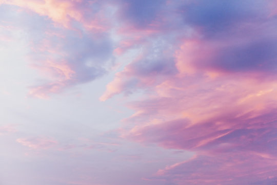 Fototapeta Pink clouds on blue sunset sky