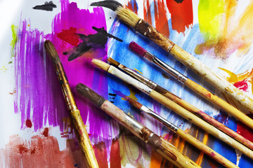 Paintbrushes on a colored paper