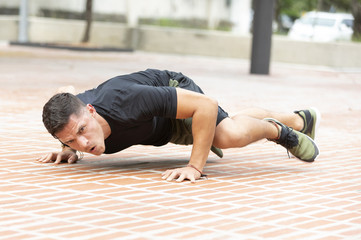 Fototapeta premium Man doing fitness in outdoor park