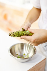 Sushi chef grating fresh Wasabi, Fresh wasabi root prepare for nigiri sushi