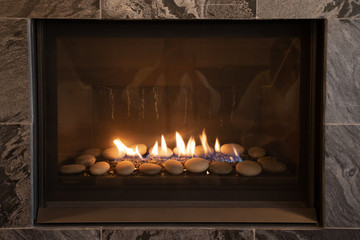 high end fireplace with glowing flames