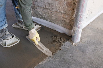 builders poured concrete at the construction site