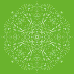 circular white contouring ornament on a green background