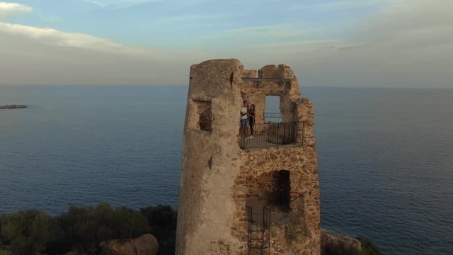 AERIAL : Saracena tower of porto frailis Bay, arbatax di tortolo, sardinia, sunset
