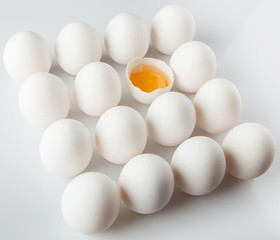 Single Cracked Egg Amongst Many Intact Eggs