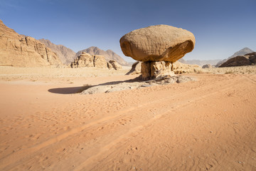 Fototapeta na wymiar huge stone in sand desert