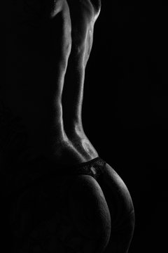 Monochrome bodyscapes of a fit tattooed woman