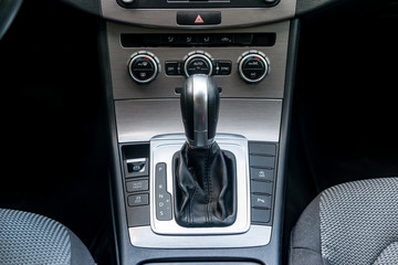 Closeup of automatic transmission inside car salon