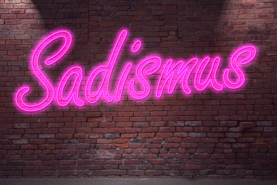 Leuchtreklame Sadismus an Ziegelsteinmauer